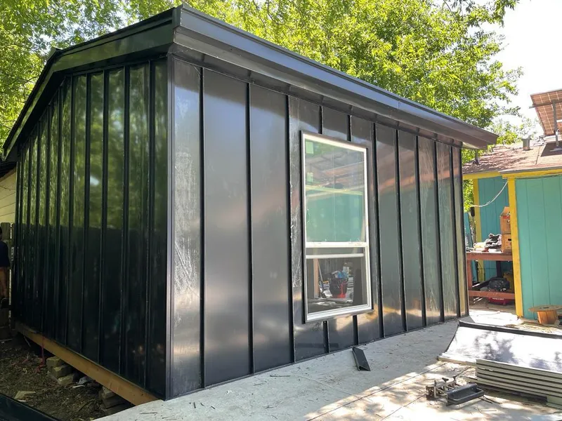 Black standing seam metal wall panels for Roof Inspection in Mena